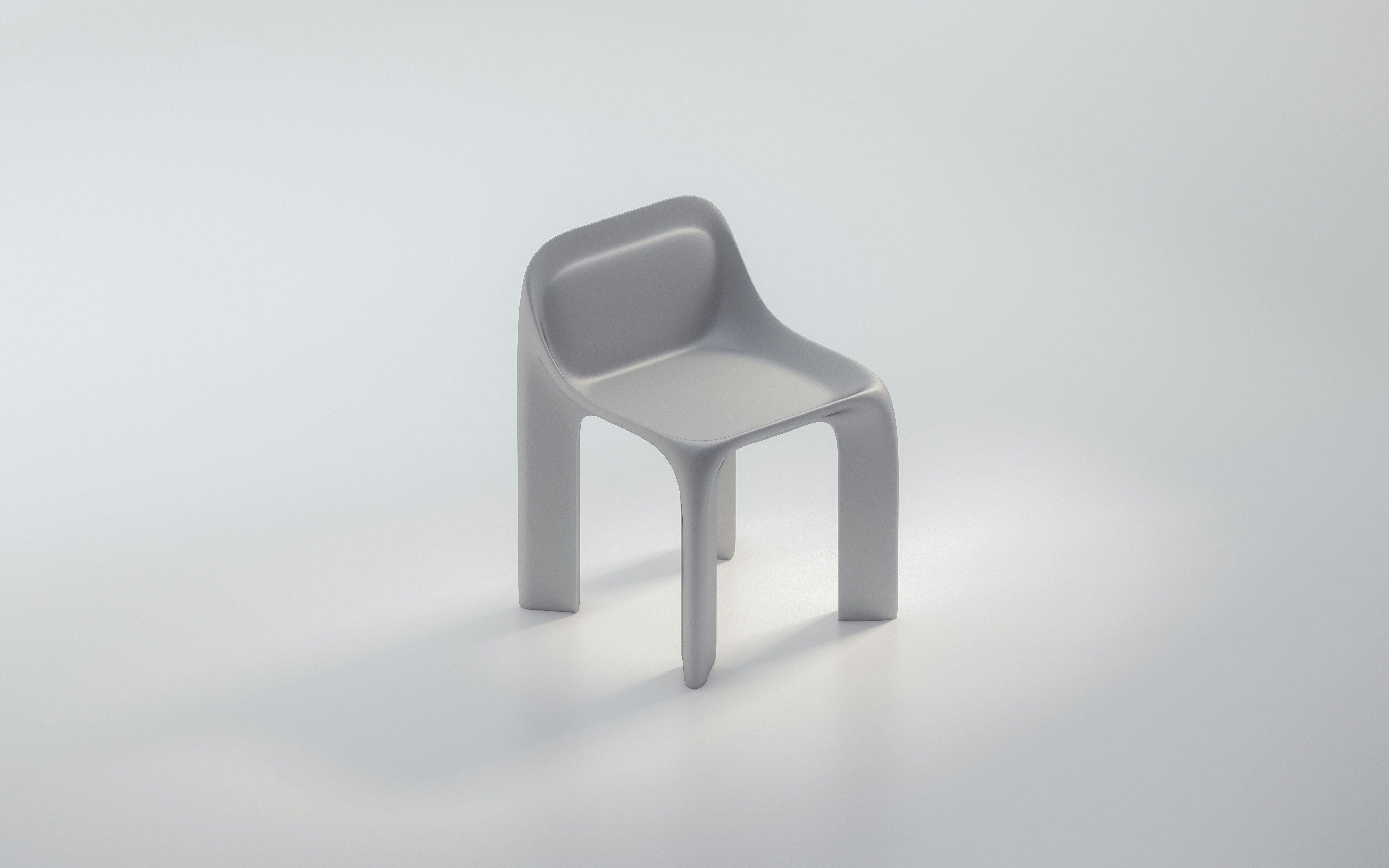 white plastic chair on white surface